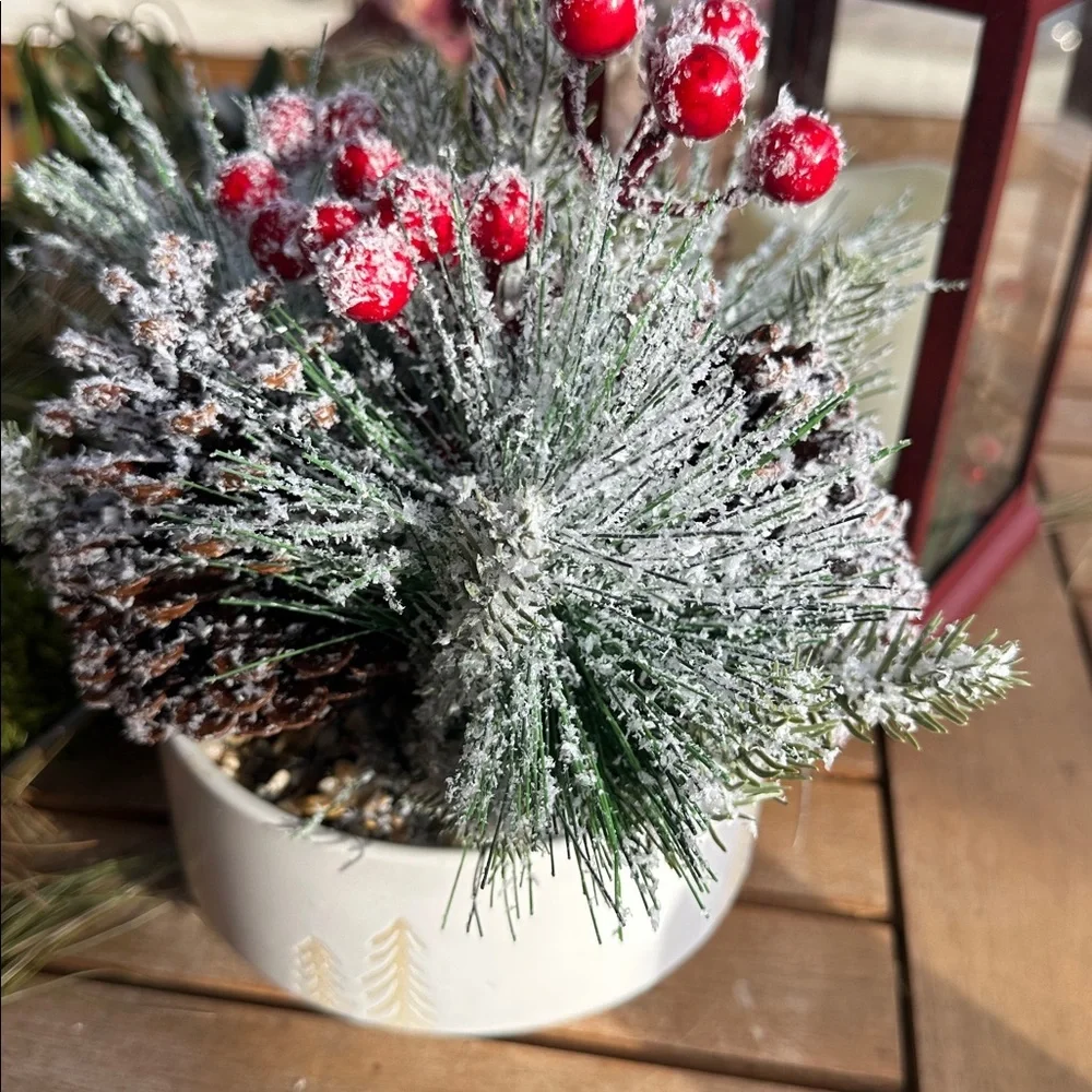 faux winter greenery in a pine tree ceramic bowl